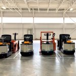 A row of crown forklifts