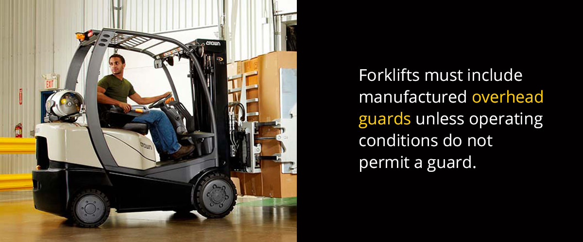 A man operates a forklift with a manufactured overhead guard.