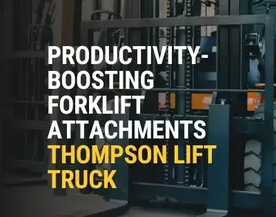 Close-up view of a forklift fitted with productivity-boosting attachments, showcasing advanced material handling equipment from Thompson Lift Truck inside an industrial warehouse