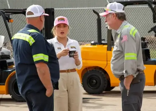Thompson Lift Truck team discussing southeast forklift rentals with technicians in front of rental equipment