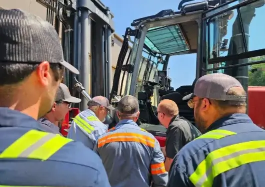 Technicians receiving hands-on southeast forklift training from Thompson Lift Truck during an OSHA-compliant session