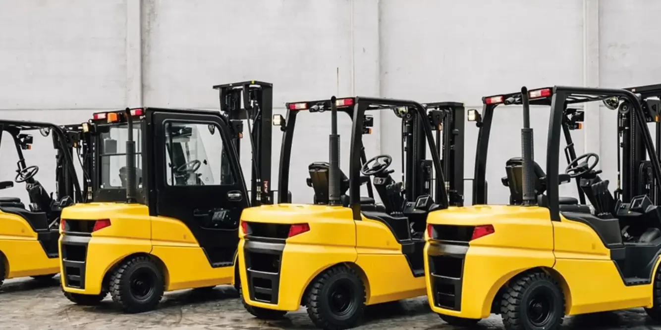 Lineup of yellow southeast forklifts at Thompson Lift Truck inside a warehouse